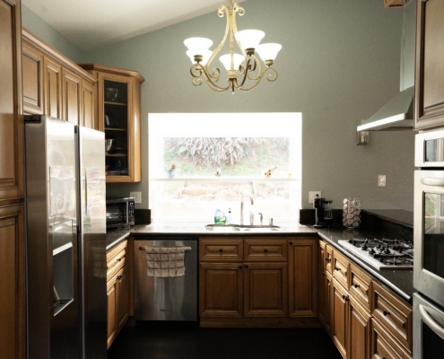Bright and functional kitchen area offering a clean, supportive environment for residents to gather.